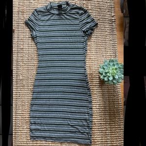 Green striped tight, mid thigh turtle neck dress